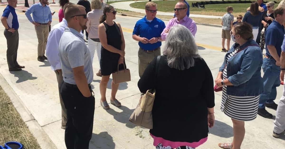 Representatives from BayCare Clinic visit with Manitowoc Mayor Justin Nickels during a ribbon-cutting event held in August