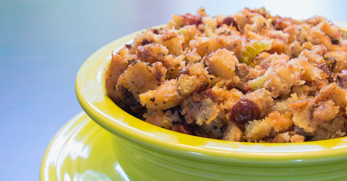A dish of stuffing with cranberries.